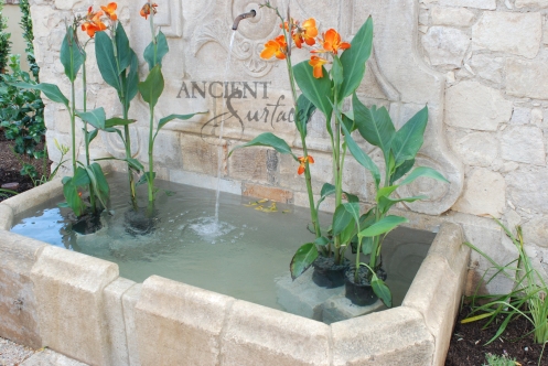 The legendary antique wall fountain, stone channel and coy pond combination, commissioned and realized by Ancient Surfaces, installed in Irvine California. Has been featured in many showcase home tours as well as on the front covers of national shelter magazines. www.AncientSurfaces.com
